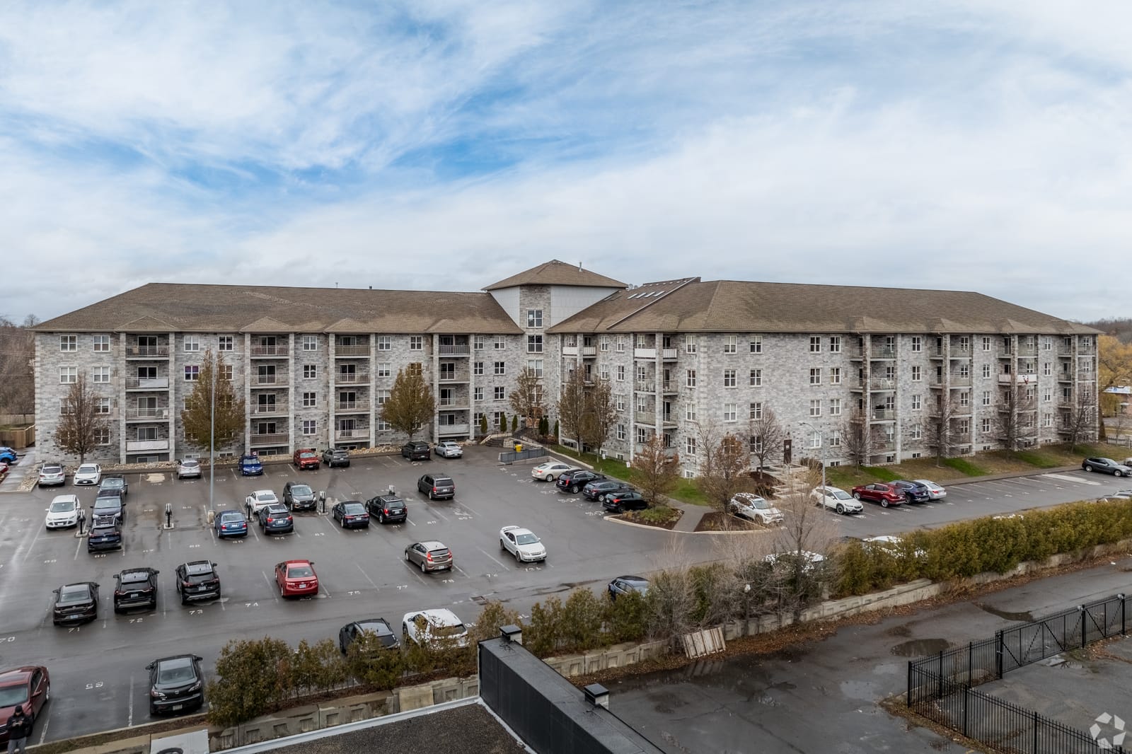 Elevated view of the whole building and resident parking lot