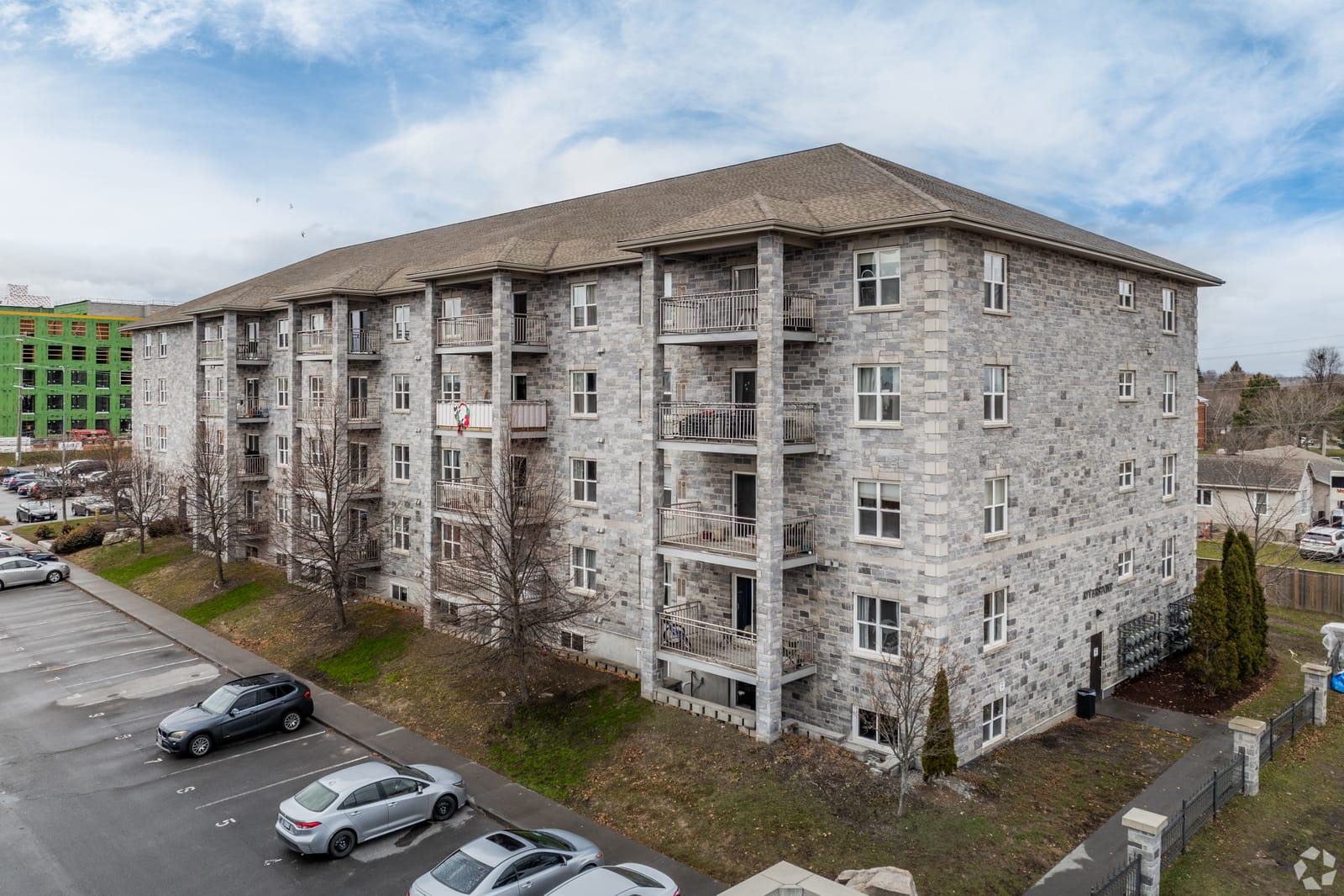 Limestone facade and covered balconies at the west end of the building