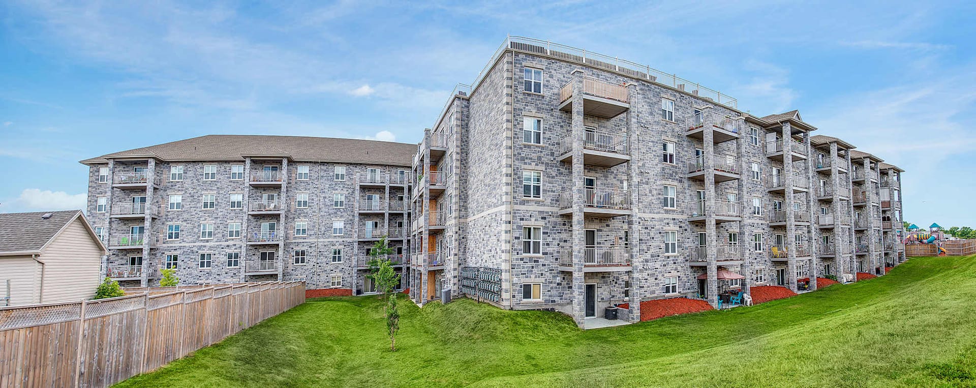 Panorama of Riverstone from the lawn behind the building