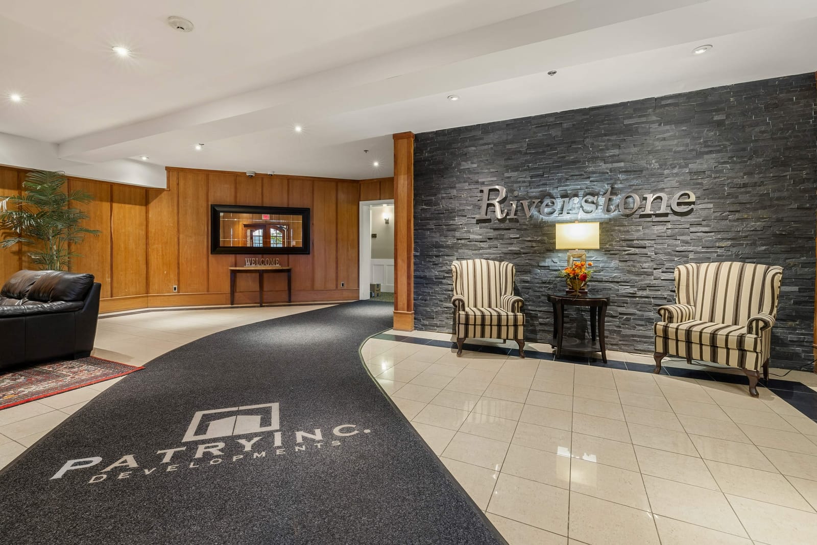 Lobby with the Riverstone sign on a slate feature wall